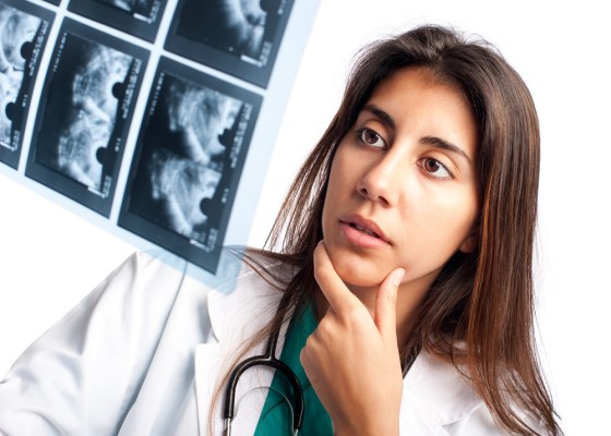 Doctor examining a mammogram