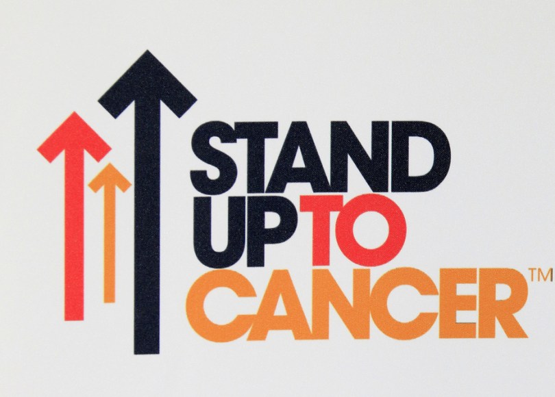 Stand Up To Cancer logo represents an organization that is working to accelerate progress against cancer